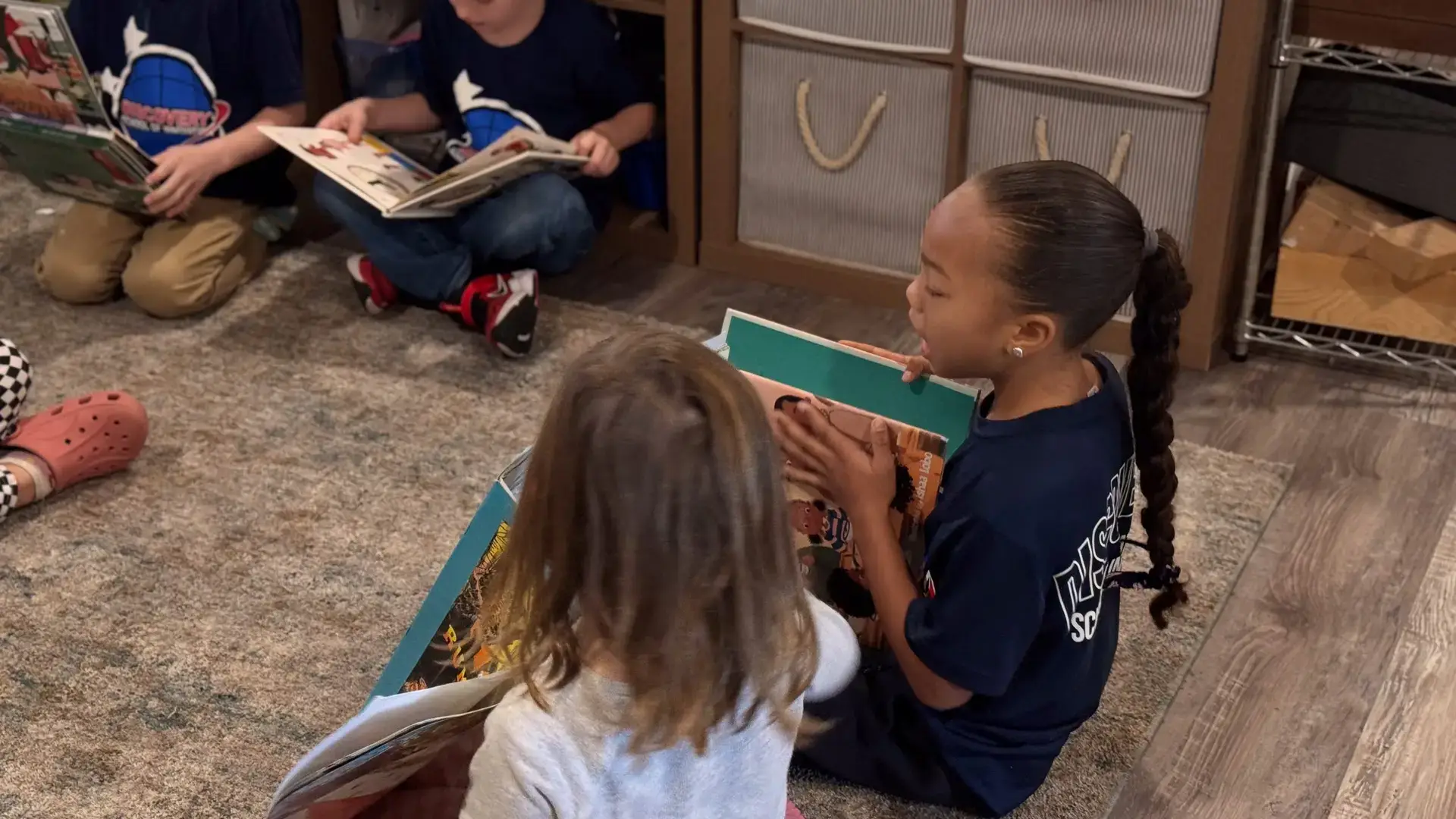 Discovery students learning together in a bright classroom