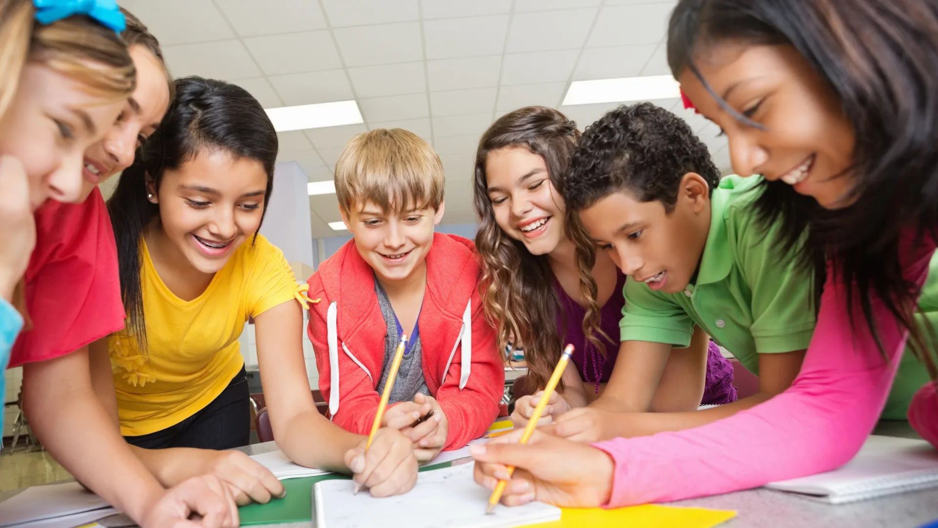 Elementary students collaborating on a classroom project